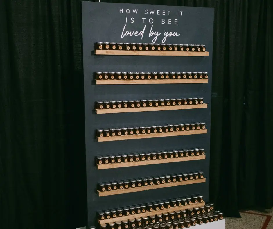 Wedding Favors by Mario Oliveto Photography Wall stacked with shelves filled with honey jars