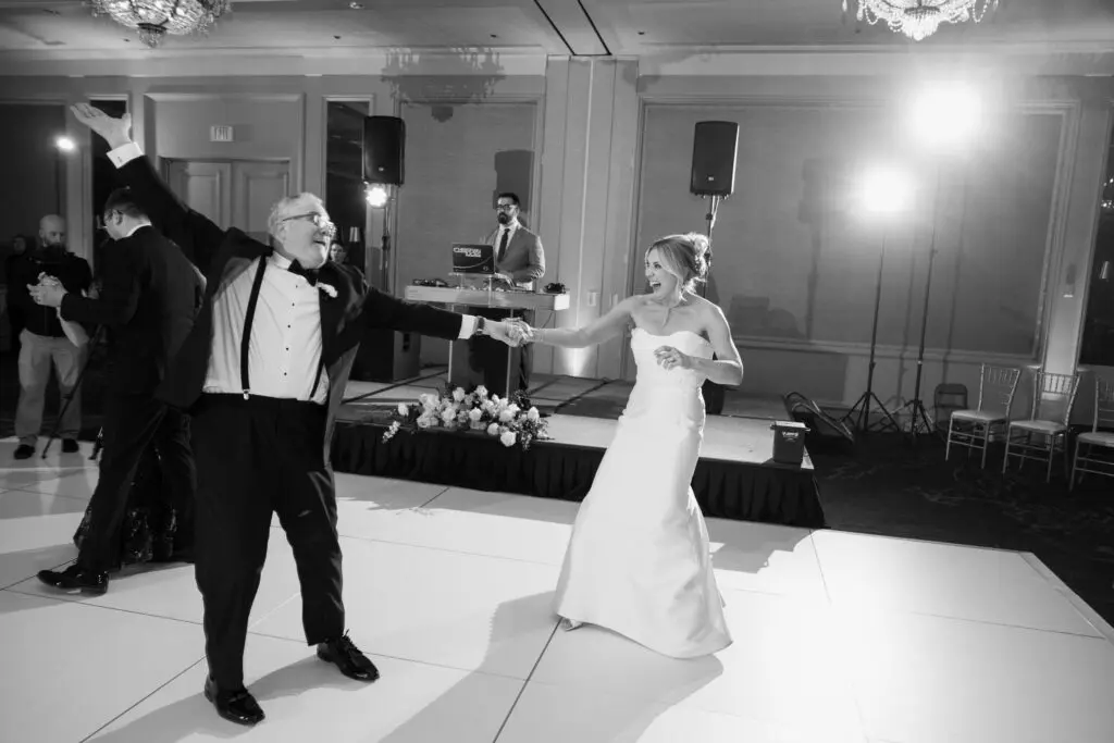 DJ Christian Lucas spinning during a happy father daughter dance at a wedding at the Logan