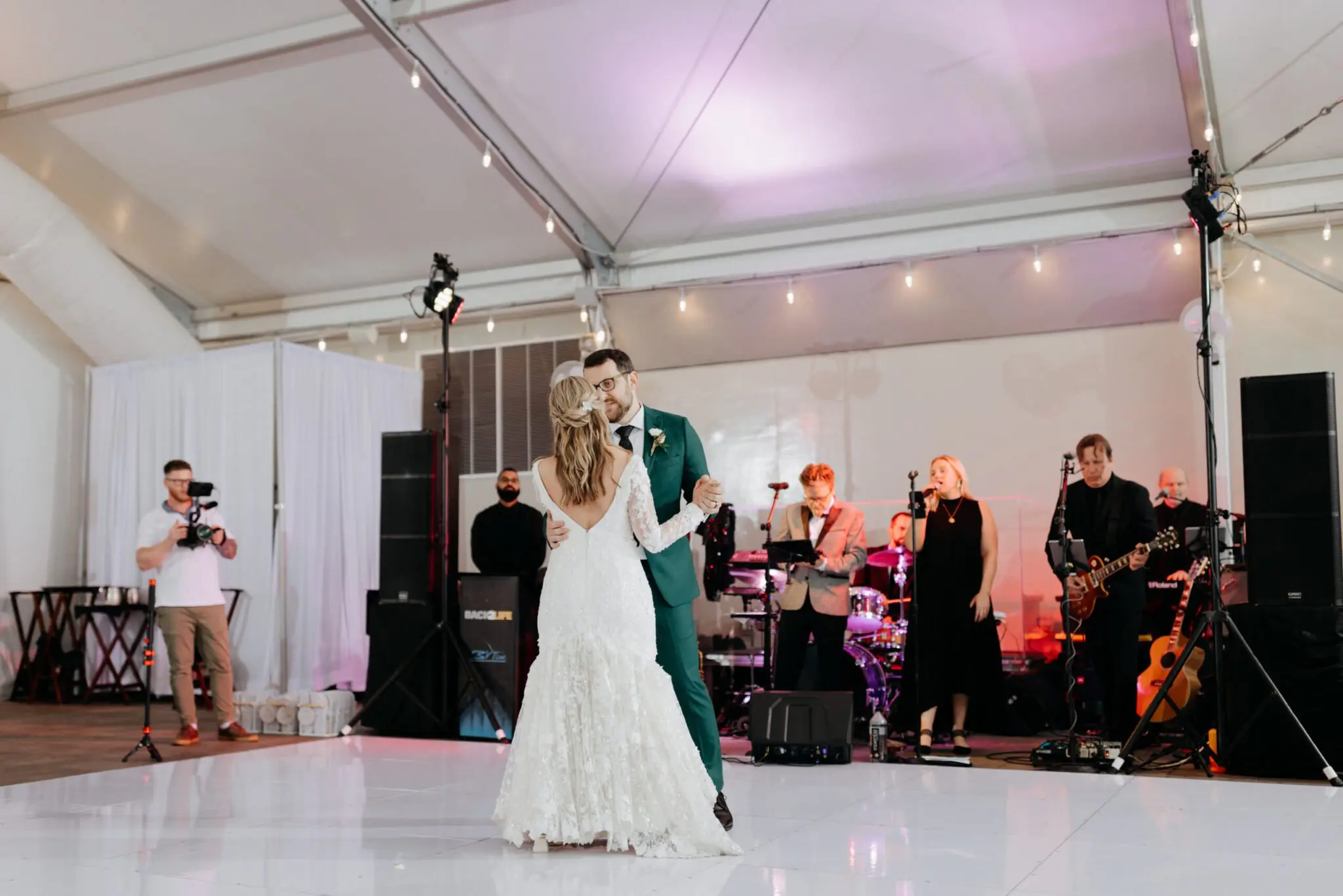 Happy couple first dance by Anna Pantusa Green suit for groom during first dance by Anna Pantusa Portraits