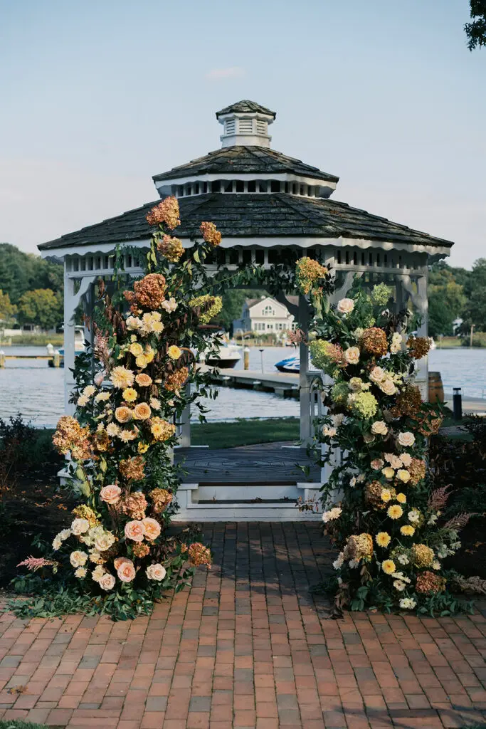 Wedding Ceremony Gazebo Flower Arch by Megan Harris Photography Wedding Ceremony Flower Arch positioned in front of Gazebo