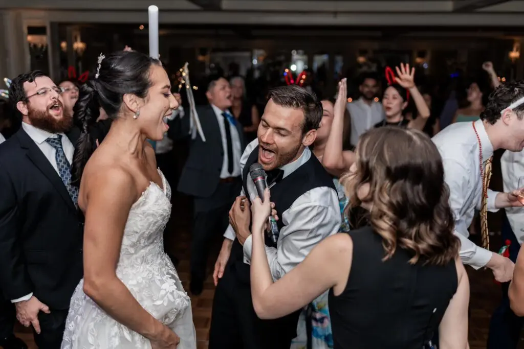 Foster the beat band sings with bride and groom
