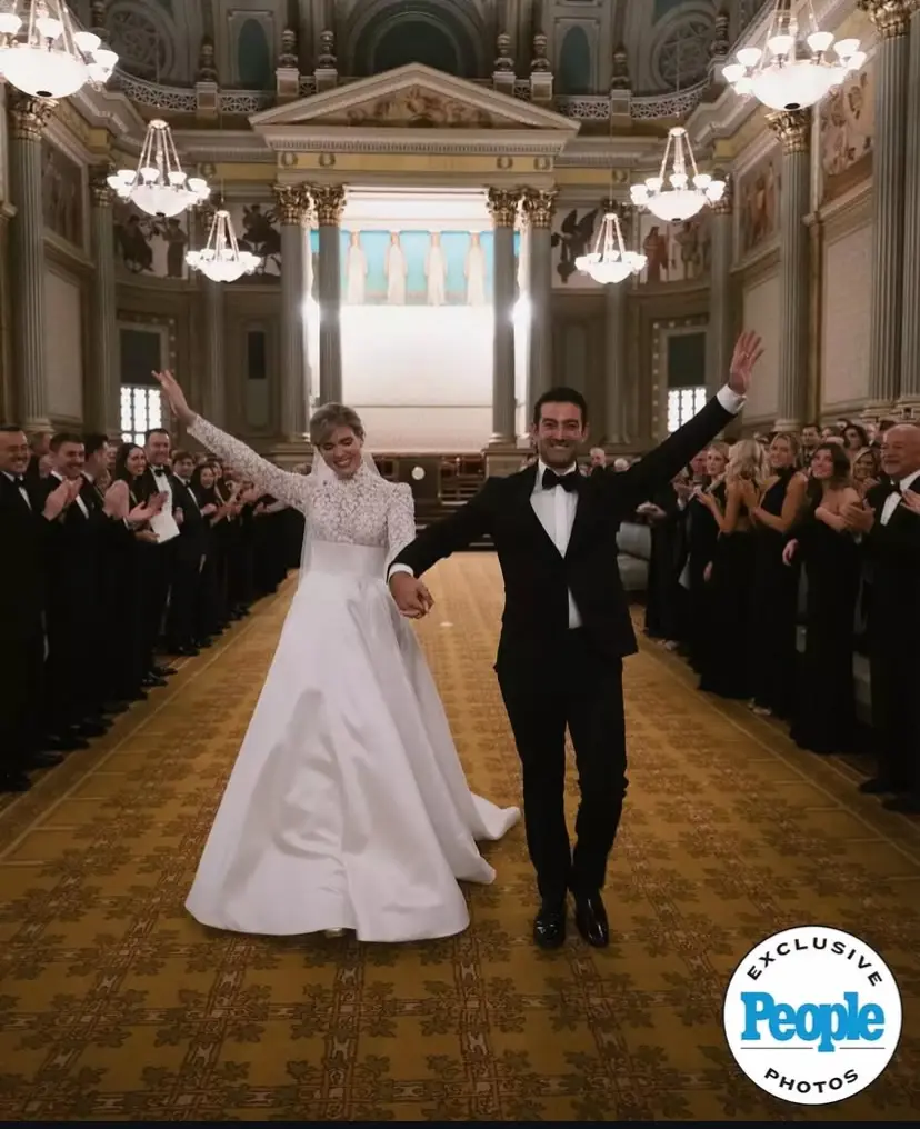 Julia Rae People Magazine by Mario Live Top Photography Bride and Groom Walking down the aisle with hands in the air