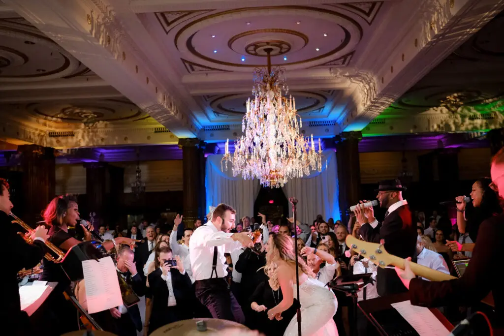 Songs for Last Dance Wedding Reception by Alison Conklin Bride and groom singing with band and guests