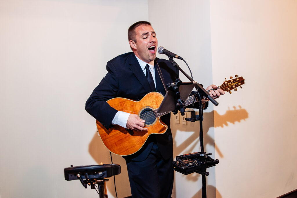 Guitarist Andrew Behringer performing at October wedding