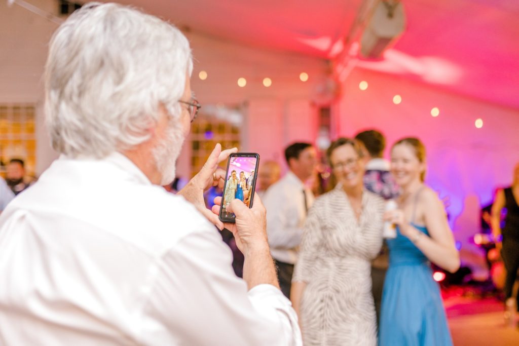 Wedding guests taking photos
