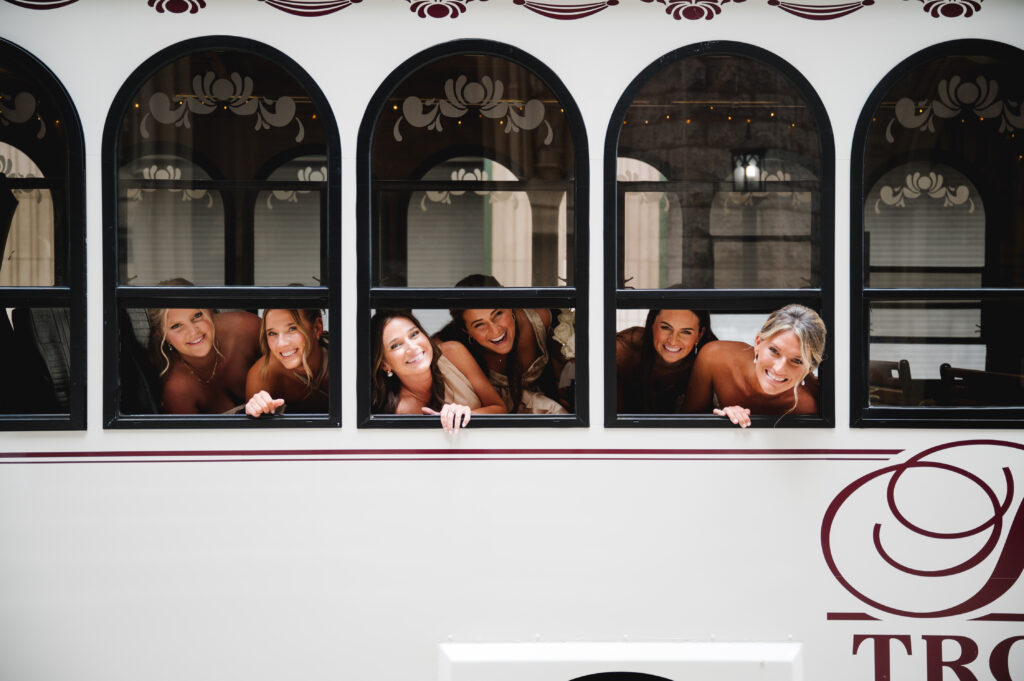 Wedding guests on a trolley headed to wedding ceremony
