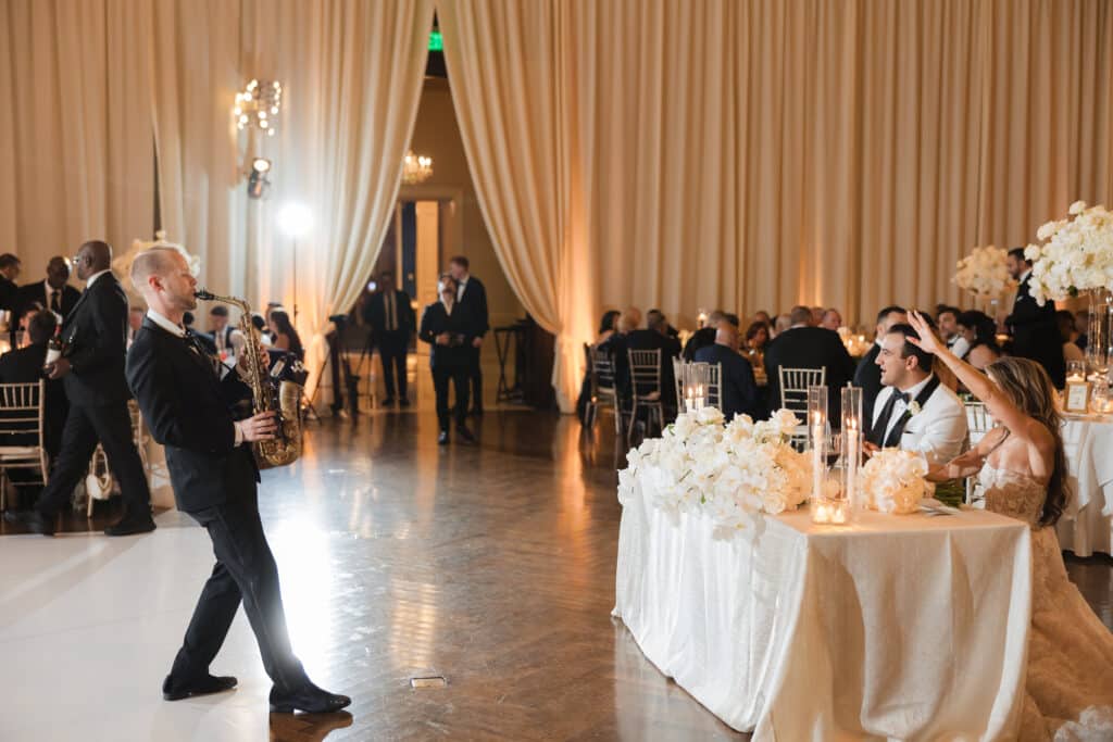 SaxOnIt performance at The Union League happy bride and groom toast