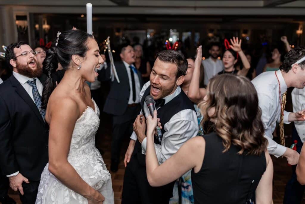 Foster the beat band sings with bride and groom