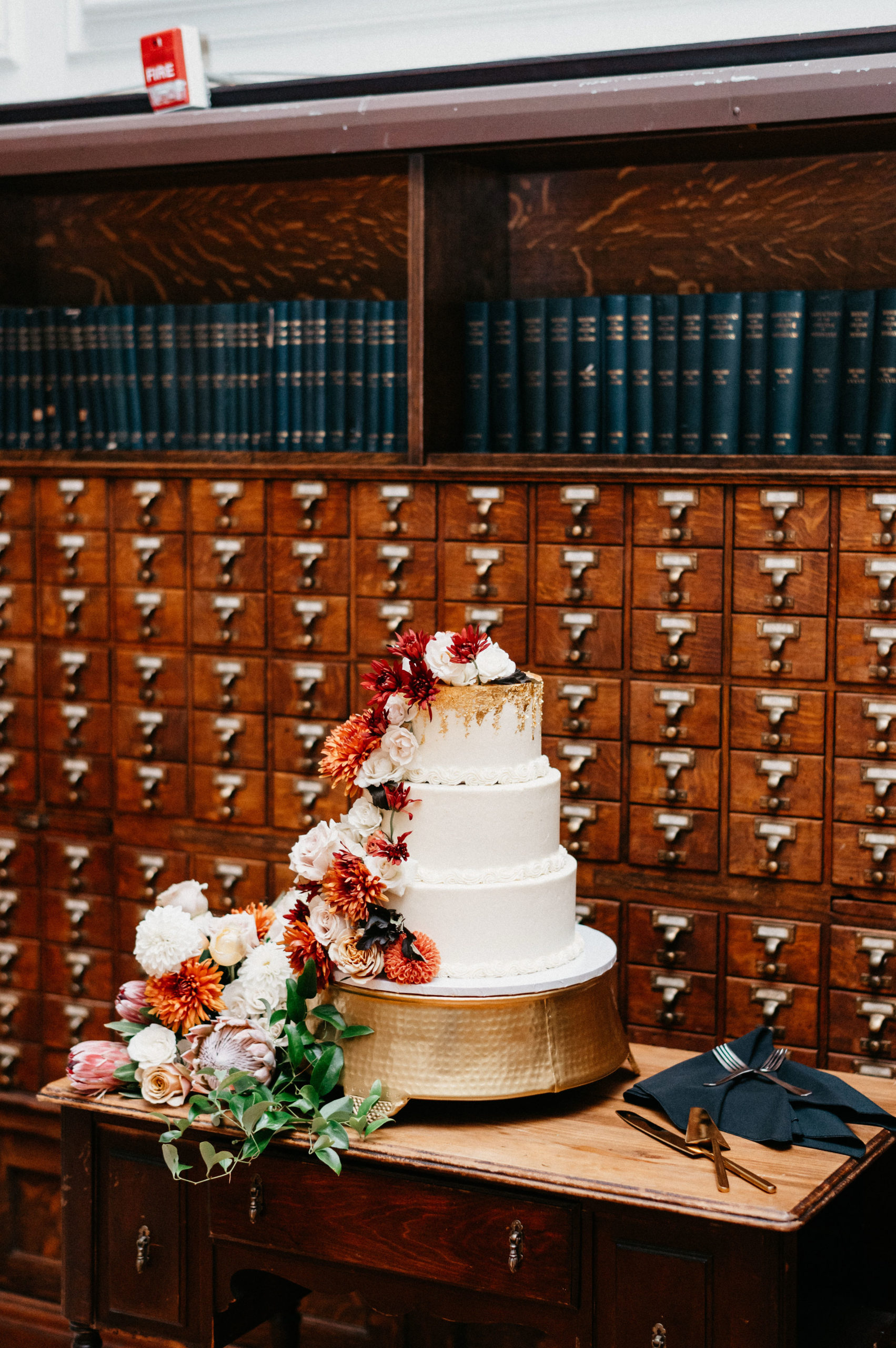 Wedding cake next to lockers