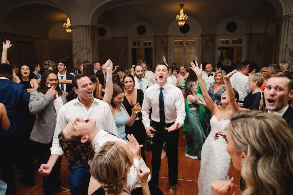 Live Band PErforming for Excited crowd of Wedding Guests by Asya Photography