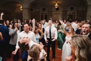 Live Band PErforming for Excited crowd of Wedding Guests by Asya Photography