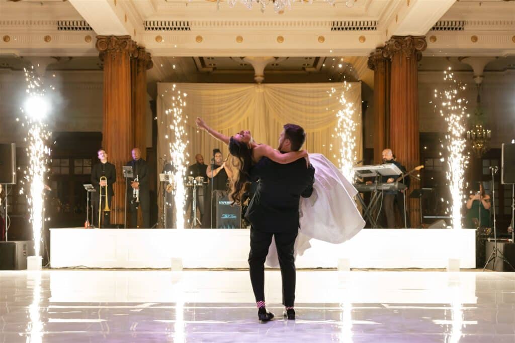 Bride and groom first dance lift DJ Alex Rossi performance