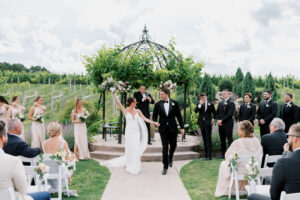 Bride and Groom Walking down the aisle holding hands